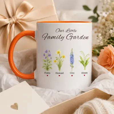 Personalized orange handle family mug with four birth flowers and custom names presented in a gift box