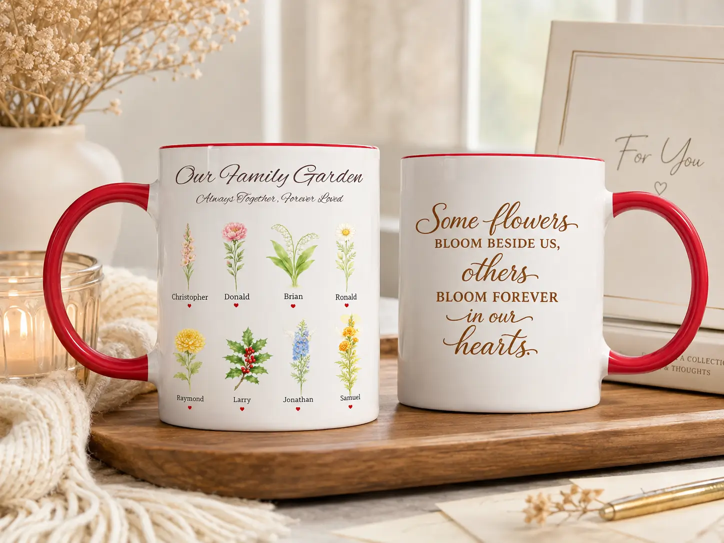Two red handle personalized family mugs showing custom birth flowers and names on the front and a remembrance quote on the back
